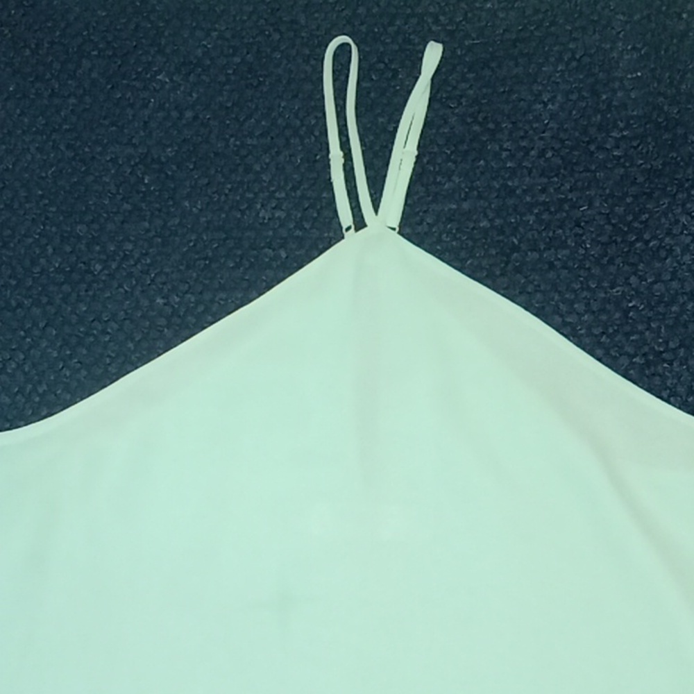MAHINA MINT GREEN  BLOUSE SIZE SMALL TOP WITH V STRAPS AT NECK AND BUTTON BACK.